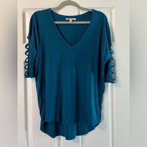 Teal shirt with 3/4 length sleeves. Size small.